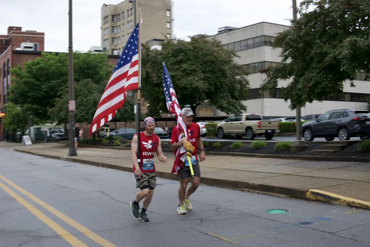 Duo Carries The U.S. Flag Through Half Marathon Course